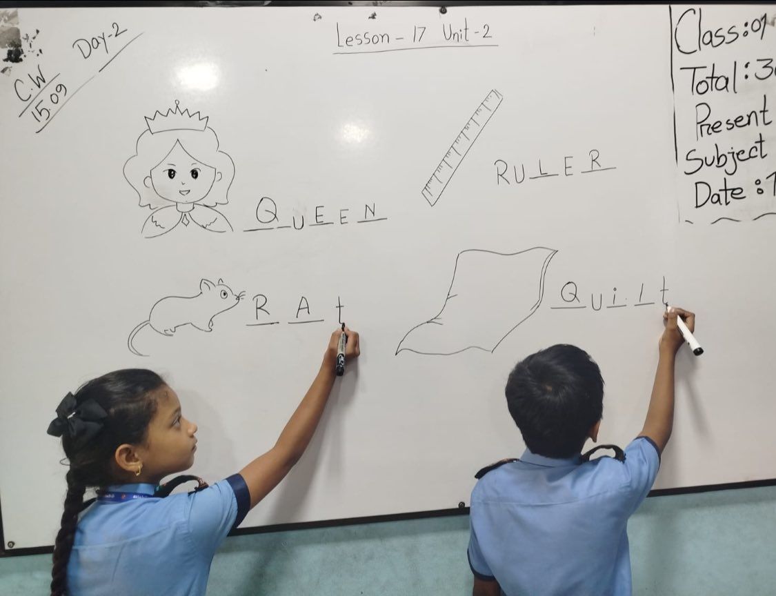 Students writing on board – English lesson practice